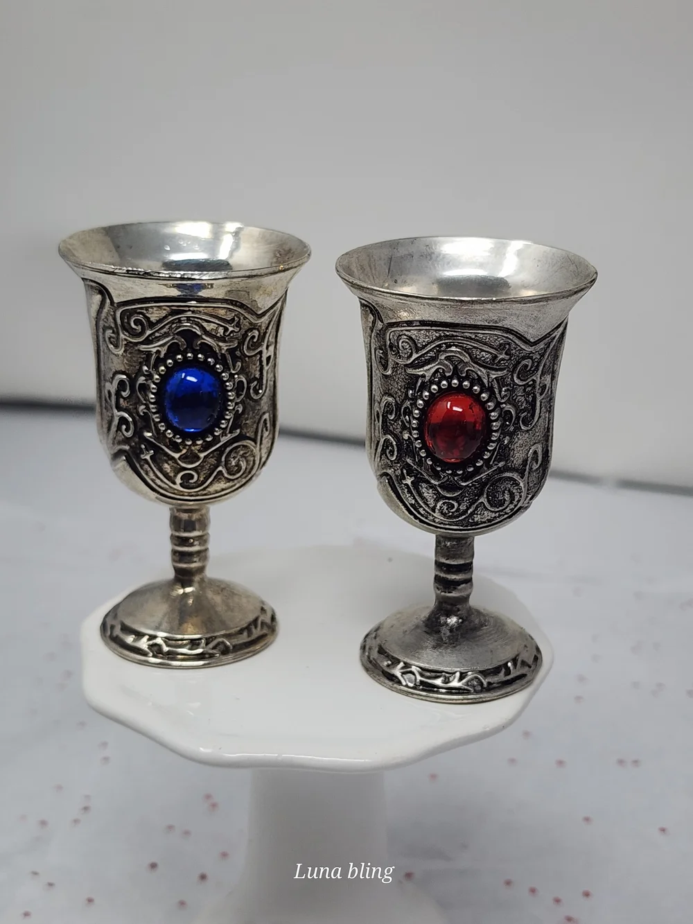 Ornate Silver Goblet Pair with Red and Blue Gem Accents